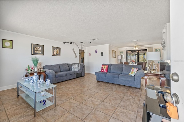 living area with baseboards, ornamental molding, a textured ceiling, and light tile patterned flooring