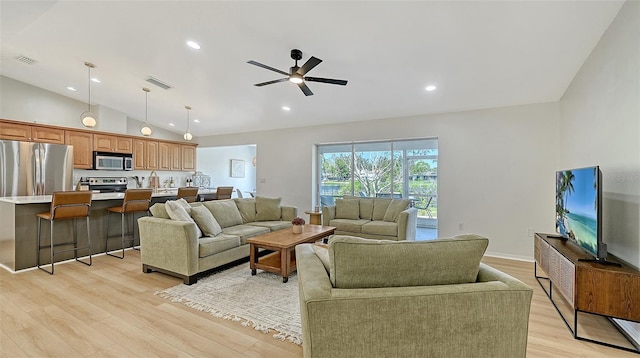 living room with light wood-style flooring, visible vents, vaulted ceiling, and recessed lighting