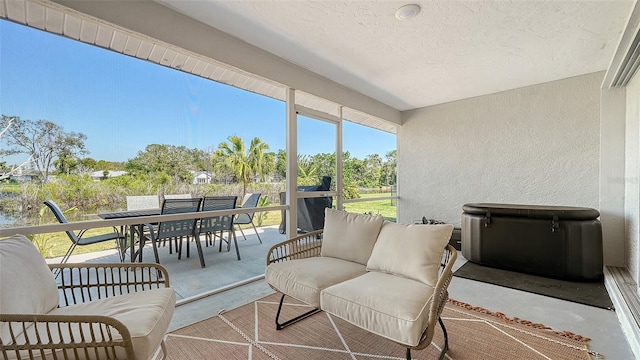 view of patio featuring outdoor dining area and an outdoor hangout area