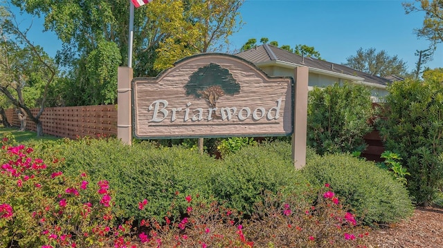 community sign with fence