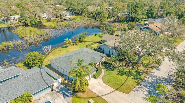 drone / aerial view featuring a residential view and a water view