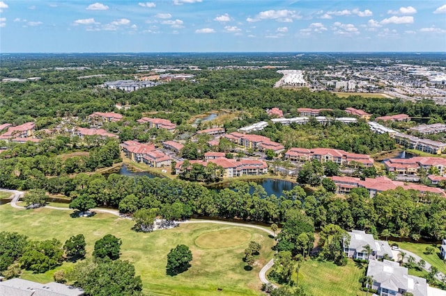 drone / aerial view with a residential view and a water view