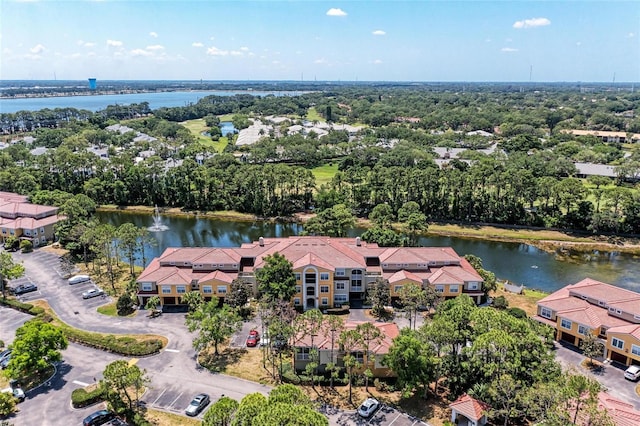 drone / aerial view with a water view and a residential view