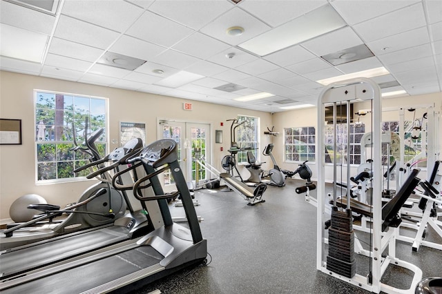 workout area featuring a drop ceiling and french doors