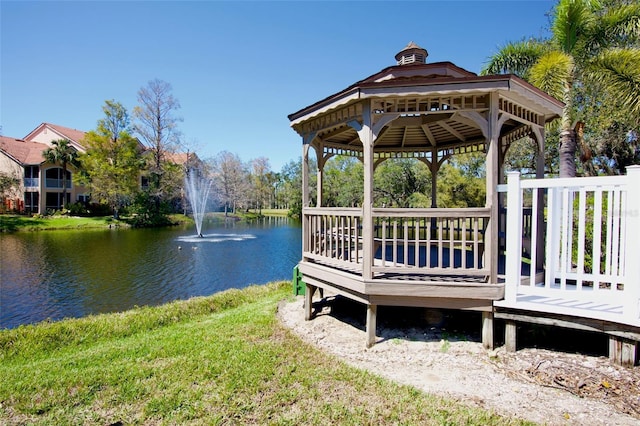 view of dock featuring a gazebo and a water view