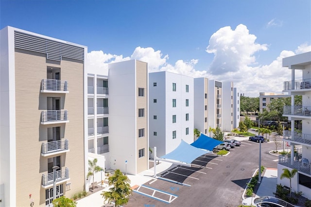 view of building exterior featuring uncovered parking