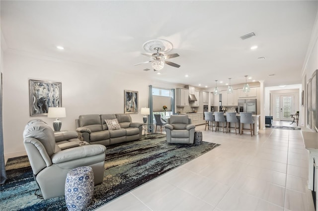 living room featuring light tile patterned floors, recessed lighting, visible vents, and crown molding