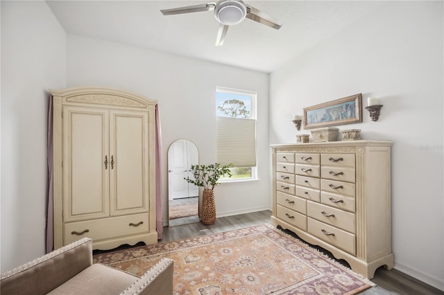 interior space featuring light wood-type flooring, baseboards, and a ceiling fan