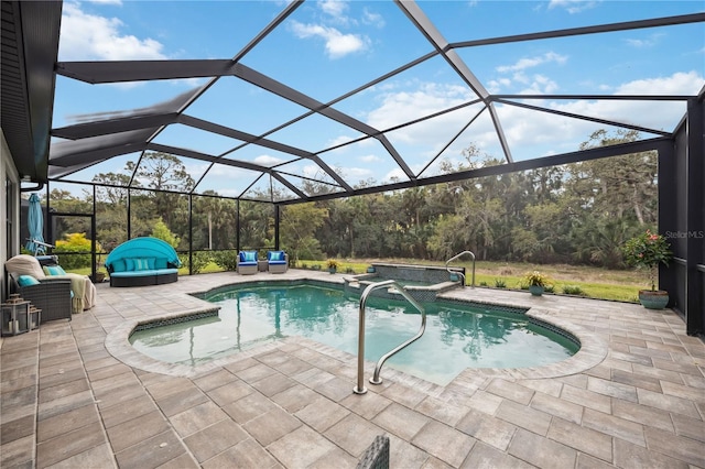 view of swimming pool with a pool with connected hot tub, a patio area, an outdoor living space, and a lanai