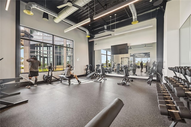 gym with a towering ceiling