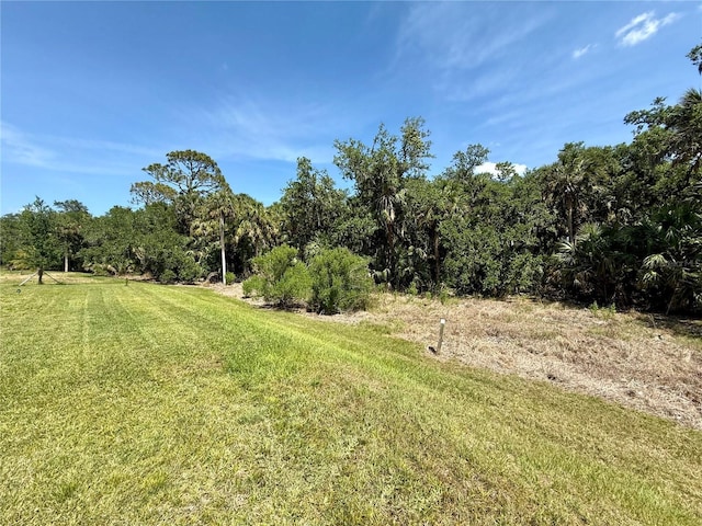 10179 Milky Way Cir, Sarasota, FL 34241 - view of yard with a view of trees