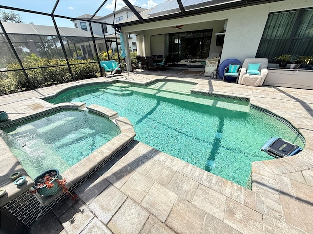 10179 Milky Way Cir, Sarasota, FL 34241 - view of swimming pool featuring glass enclosure, ceiling fan, a pool with connected hot tub, and a patio area