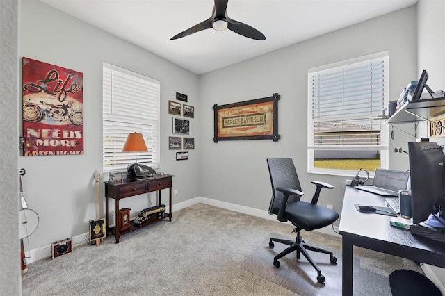 office featuring carpet, baseboards, and a ceiling fan