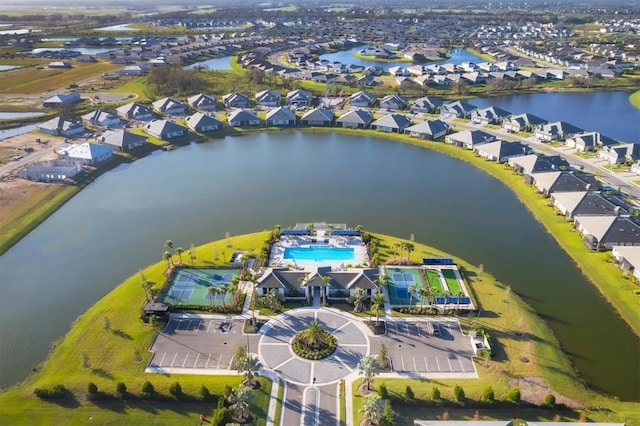 drone / aerial view featuring a water view and a residential view