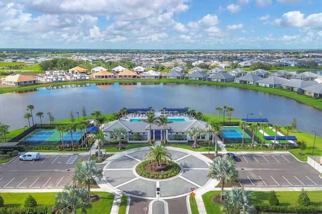 birds eye view of property featuring a water view and a residential view