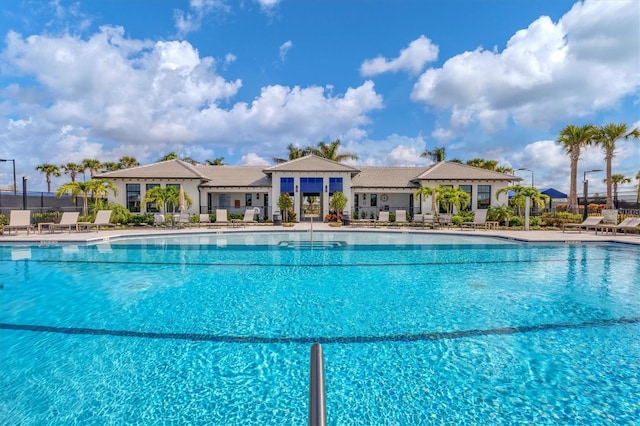 pool featuring a patio area and fence