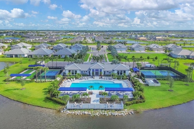 drone / aerial view with a water view and a residential view