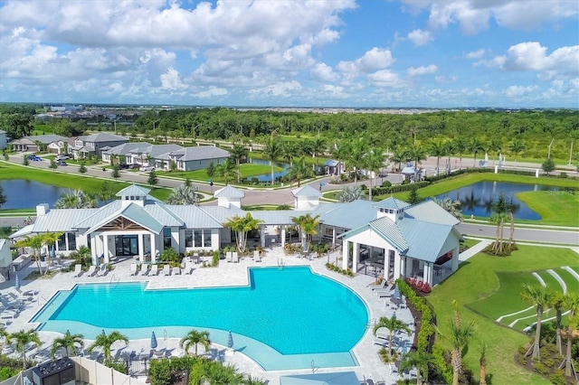 pool with a patio area, a gazebo, a water view, and a residential view