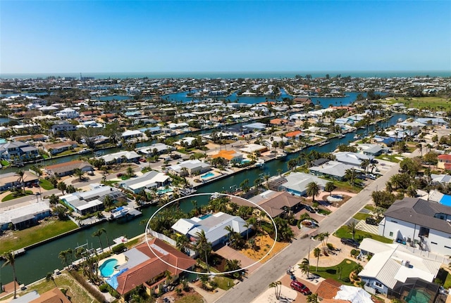 bird's eye view with a water view and a residential view