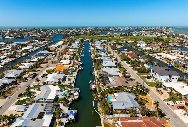 drone / aerial view featuring a residential view and a water view