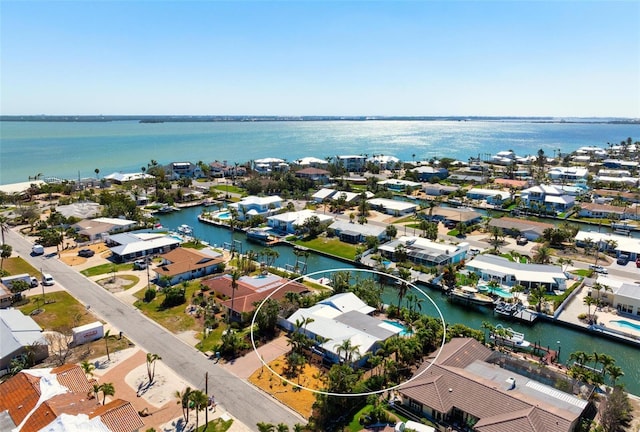 bird's eye view with a residential view and a water view