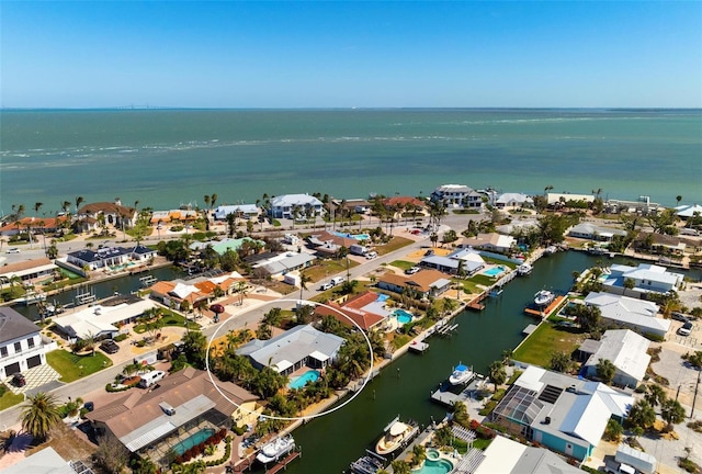 bird's eye view featuring a residential view and a water view