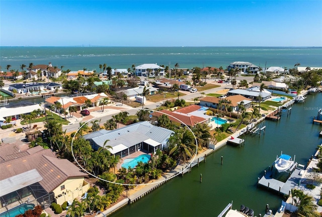 bird's eye view featuring a residential view and a water view