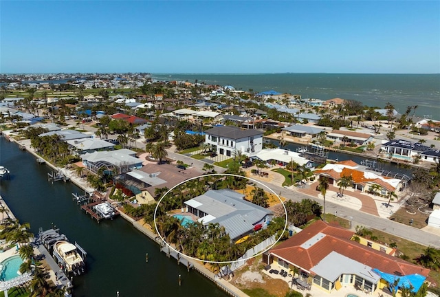 bird's eye view featuring a residential view and a water view