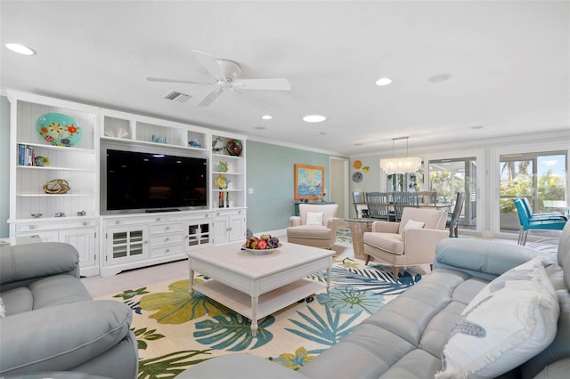 living room featuring built in features, visible vents, recessed lighting, crown molding, and ceiling fan with notable chandelier