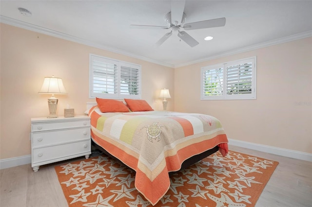 bedroom with a ceiling fan, wood finished floors, baseboards, and ornamental molding