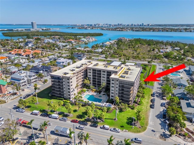 birds eye view of property with a view of city and a water view