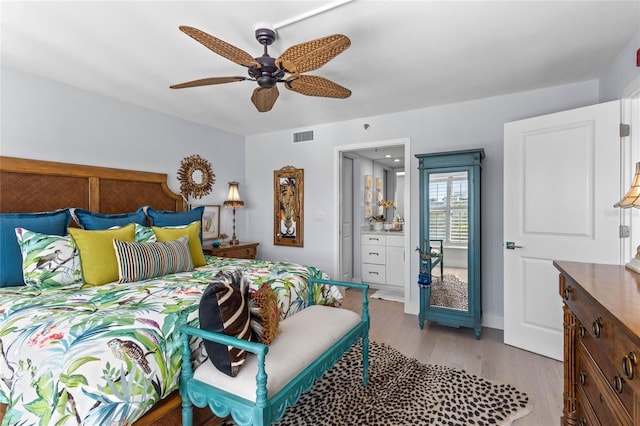 bedroom featuring baseboards, visible vents, light wood-type flooring, and ceiling fan