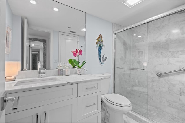 full bathroom with vanity, toilet, recessed lighting, and a stall shower