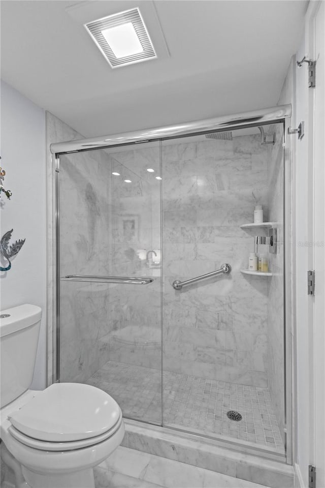 full bathroom with a marble finish shower, toilet, visible vents, and marble finish floor