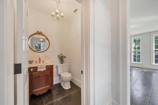 bathroom featuring toilet, visible vents, baseboards, vanity, and crown molding