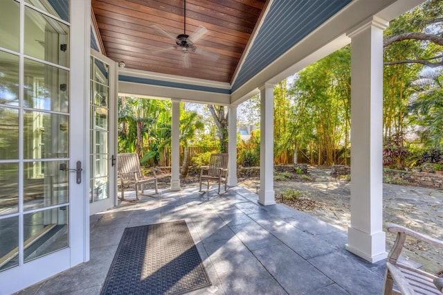 view of patio with a ceiling fan and fence