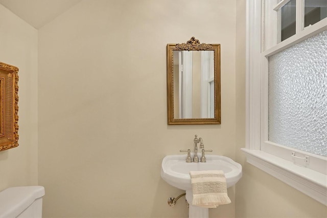 bathroom featuring a sink and toilet