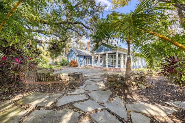 exterior space featuring a sunroom