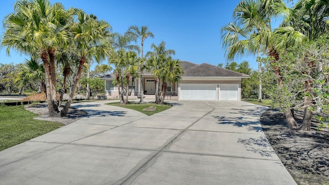 view of front of home with a garage and driveway