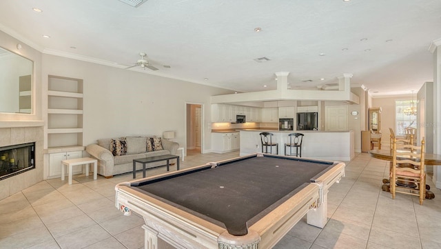 playroom featuring light tile patterned floors, built in features, and pool table