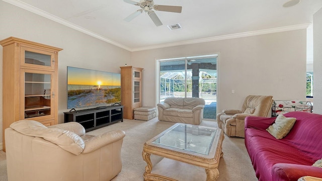 living room featuring light carpet, visible vents, crown molding, and a ceiling fan