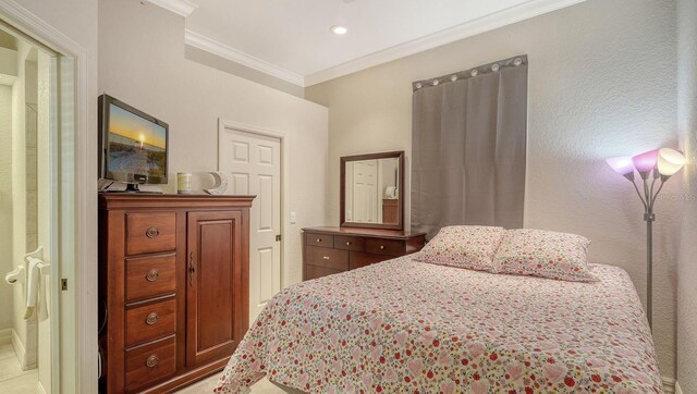 bedroom with recessed lighting and ornamental molding