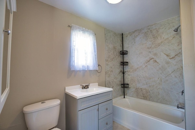 bathroom featuring washtub / shower combination, vanity, and toilet