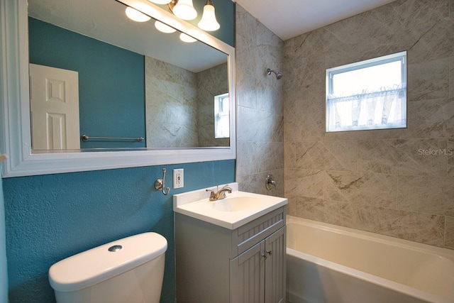 full bath featuring shower / bathing tub combination, vanity, and toilet