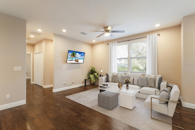 living room featuring dark wood-style flooring, recessed lighting, visible vents, and baseboards