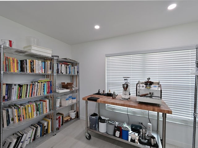 office space with wood finished floors, a wealth of natural light, and recessed lighting