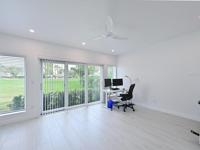 office area featuring baseboards, a ceiling fan, a wealth of natural light, and recessed lighting