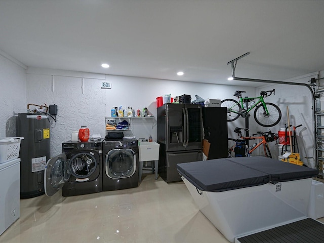 garage featuring a textured wall, black refrigerator with ice dispenser, water heater, separate washer and dryer, and a sink