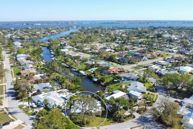 drone / aerial view with a residential view and a water view