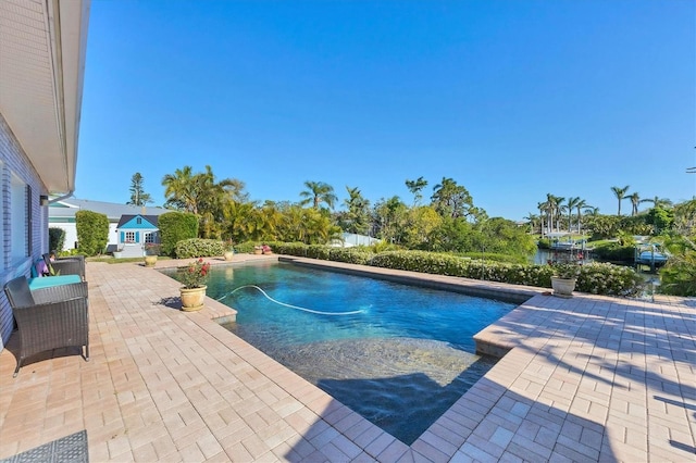 outdoor pool featuring a patio area